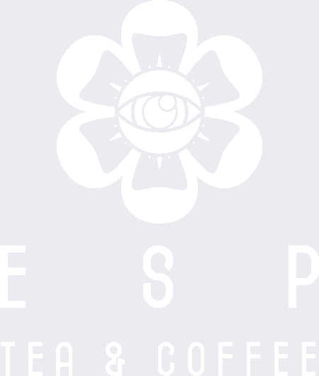 A stylized flower design with an eye at its center is above partially visible text that reads "TEA & COFFEE." The image has a light gray and white color scheme.
